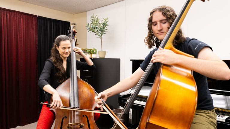 Professor of double bass works with her student