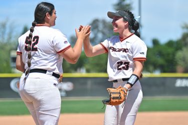 Pacific softball celebrates with high five