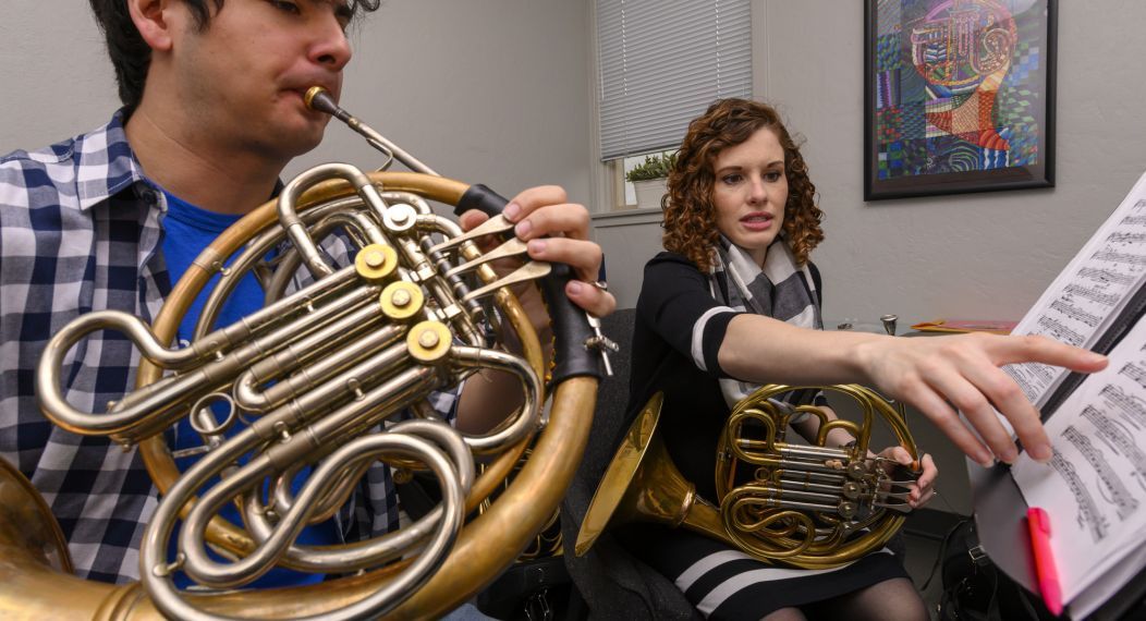 Conservatory faculty teaching a horn lesson