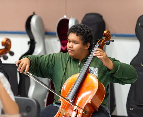 a student plays the cello