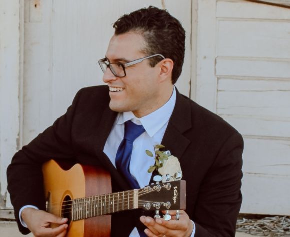 a professor playing the guitar